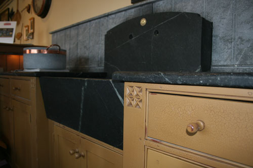 Pieced slant front sink with high backsplash