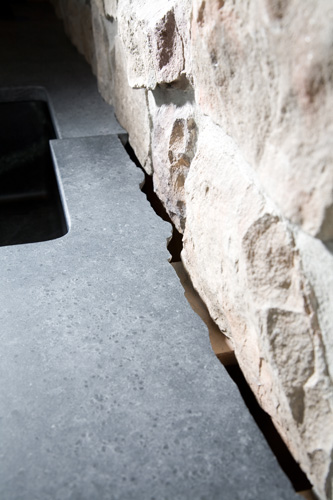 Soapstone fit to stone wall