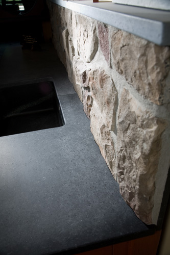 Soapstone fit to a stone wall